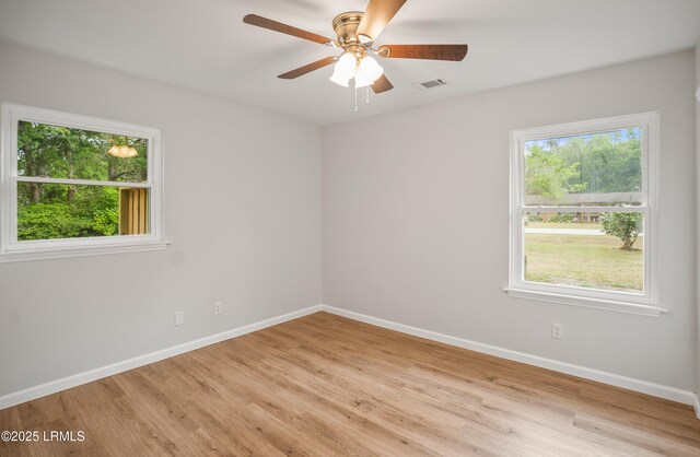 46 Mroz Rd, Beaufort, SC 29906 - empty room with light wood-style flooring, baseboards, and ceiling fan