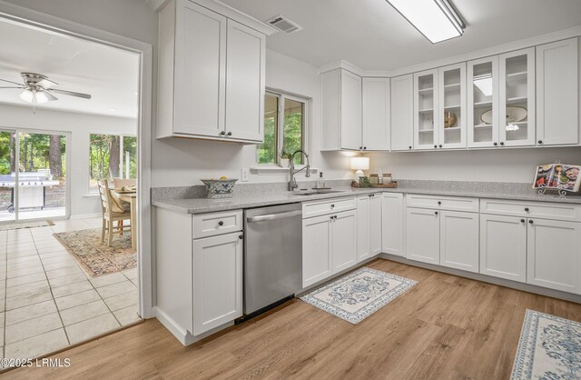 46 Mroz Rd, Beaufort, SC 29906 - kitchen featuring dishwasher, a sink, a ceiling fan, white cabinets, and light wood-style flooring