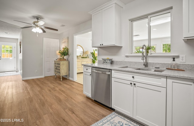 46 Mroz Rd, Beaufort, SC 29906 - kitchen with dishwasher, ceiling fan, light wood-type flooring, white cabinets, and a sink