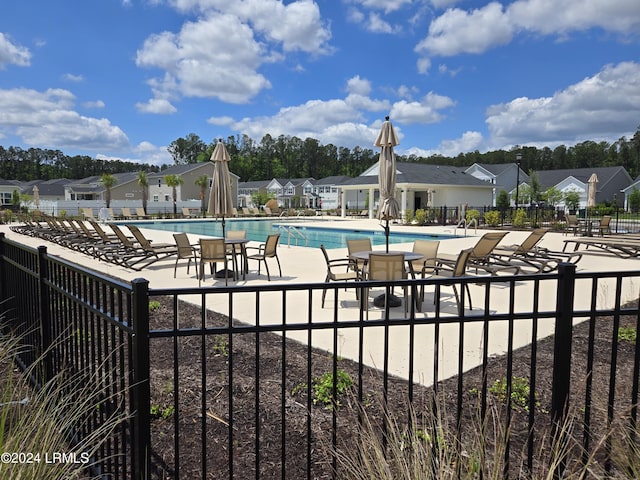 view of swimming pool with a patio area