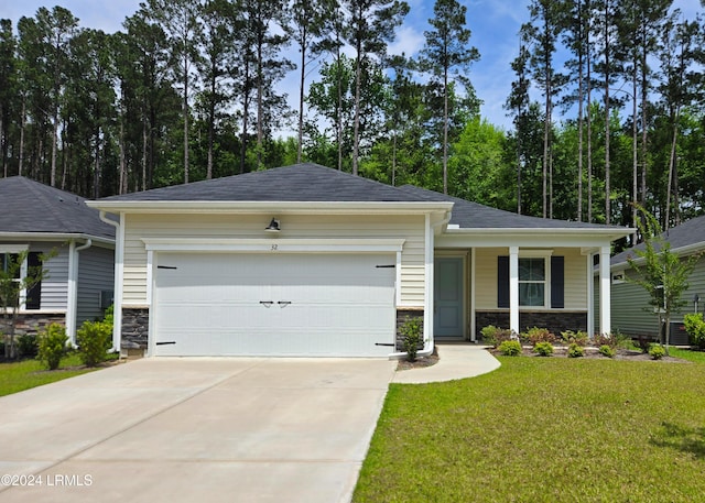 view of front facade with a garage and a front yard