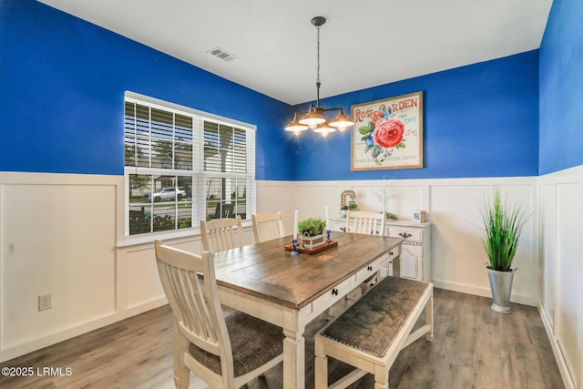13 Hager Rd, Bluffton, SC 29910 - dining space featuring a chandelier, wood finished floors, wainscoting, and visible vents