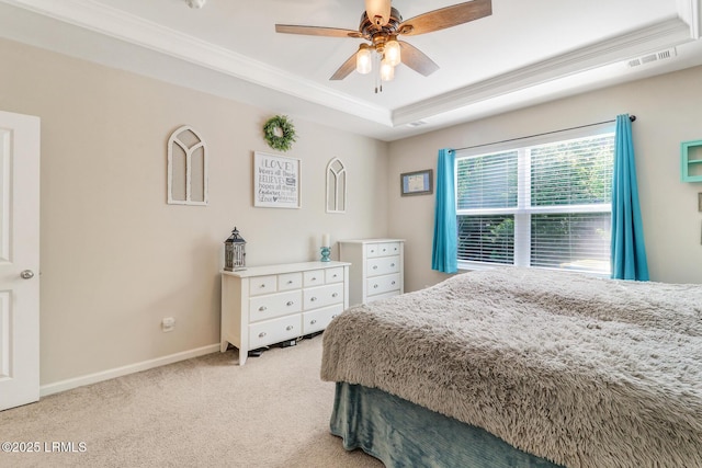 13 Hager Rd, Bluffton, SC 29910 - bedroom with visible vents, baseboards, a raised ceiling, ornamental molding, and light colored carpet