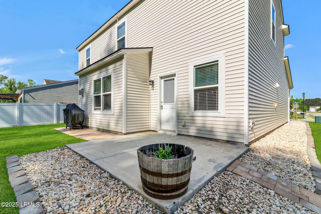 13 Hager Rd, Bluffton, SC 29910 - rear view of property featuring a patio area, fence, and a yard