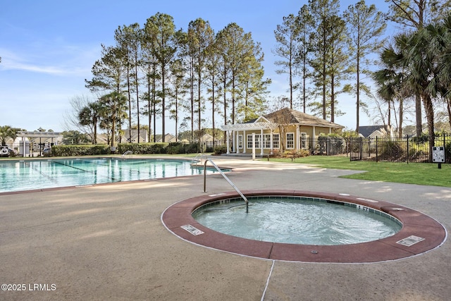 32 Aspen Hall Rd, Bluffton, SC 29910 - community pool with fence, a community hot tub, an outbuilding, and a patio