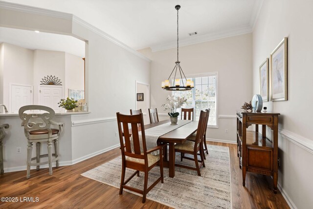 32 Aspen Hall Rd, Bluffton, SC 29910 - dining room with an inviting chandelier, wood finished floors, visible vents, ornamental molding, and baseboards