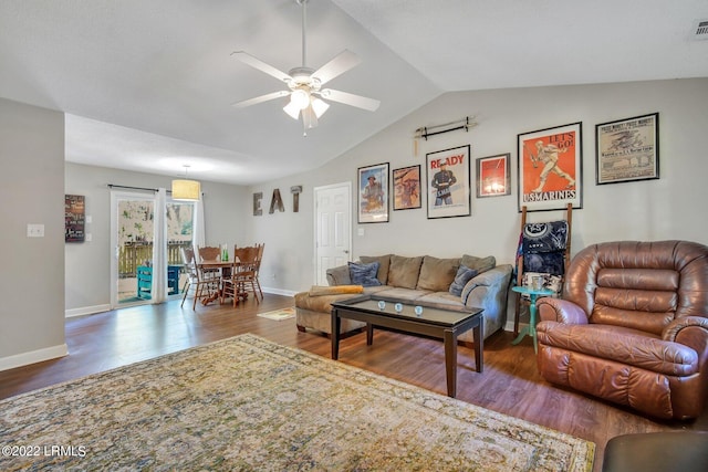 living room with vaulted ceiling, wood finished floors, a ceiling fan, and baseboards