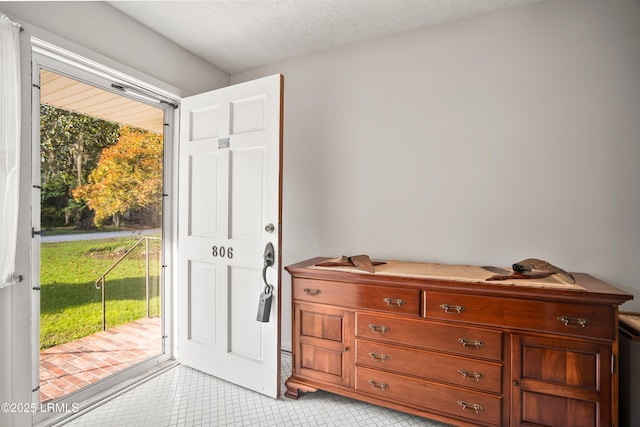 806 Coates Ln, Beaufort, SC 29902 - entrance foyer with light tile patterned flooring and a textured ceiling