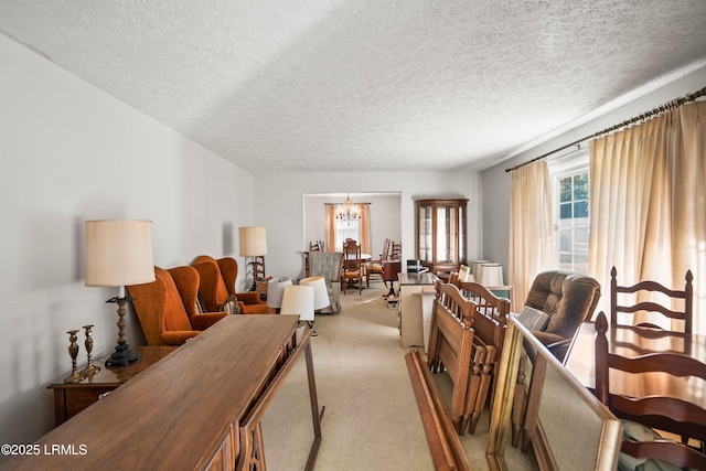 806 Coates Ln, Beaufort, SC 29902 - living room featuring light colored carpet, a textured ceiling, and a chandelier