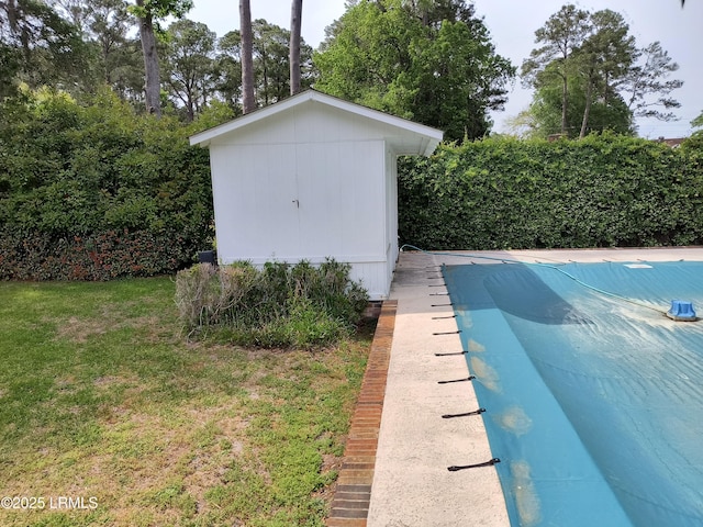 806 Coates Ln, Beaufort, SC 29902 - view of swimming pool with a shed, an outdoor structure, and a yard