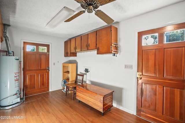 806 Coates Ln, Beaufort, SC 29902 - foyer entrance with gas water heater, a ceiling fan, wood finished floors, a textured ceiling, and baseboards
