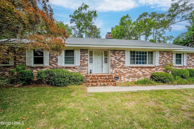 806 Coates Ln, Beaufort, SC 29902 - view of front of home with brick siding, a front yard, a chimney, and entry steps