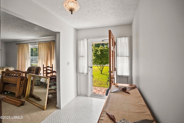 806 Coates Ln, Beaufort, SC 29902 - entryway with a textured ceiling, baseboards, and carpet