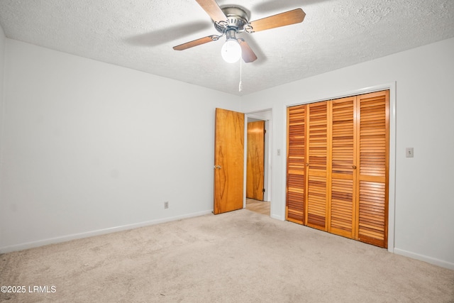 806 Coates Ln, Beaufort, SC 29902 - unfurnished bedroom featuring carpet floors, a closet, a textured ceiling, baseboards, and a ceiling fan