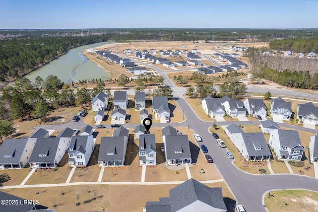 bird's eye view with a residential view and a water view