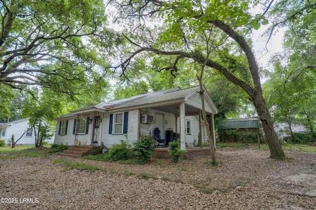 441 Byrnes Ln, Allendale, SC 29810 - view of front of house featuring metal roof, covered porch, and a wall mounted AC