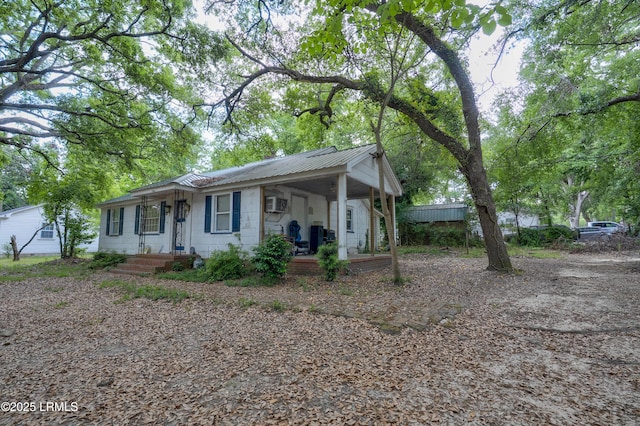 441 Byrnes Ln, Allendale, SC 29810 - ranch-style house with metal roof, covered porch, and concrete block siding