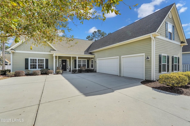 view of front of house with concrete driveway and an attached garage