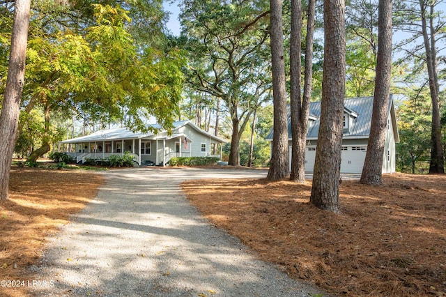 view of front of property featuring a garage and a porch