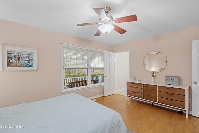 bedroom with light hardwood / wood-style floors and ceiling fan