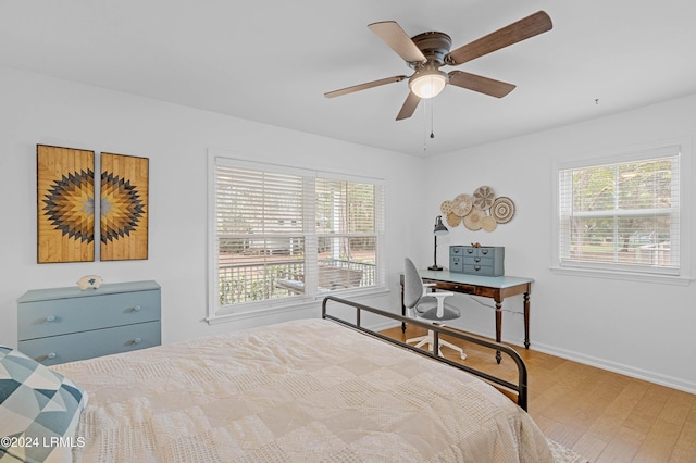 bedroom featuring light hardwood / wood-style flooring and ceiling fan