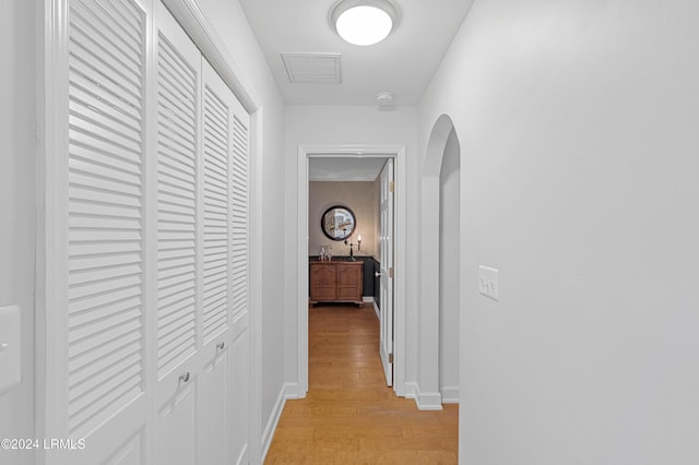 hall with light hardwood / wood-style floors