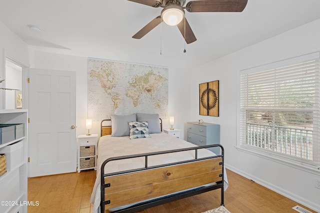 bedroom featuring ceiling fan and light hardwood / wood-style flooring