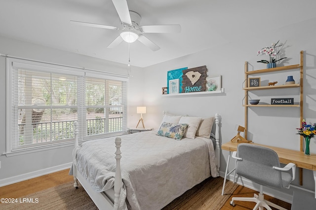 bedroom with wood-type flooring and ceiling fan