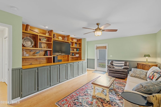 living room with ceiling fan and light hardwood / wood-style floors