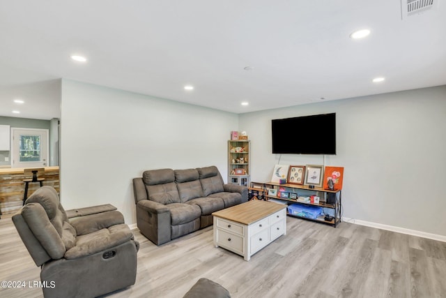 living room with light hardwood / wood-style flooring