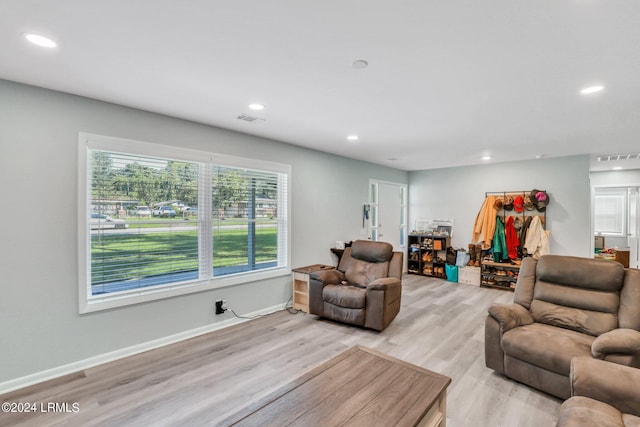 living room with light hardwood / wood-style flooring