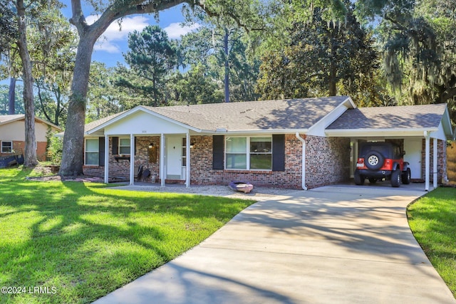 single story home featuring a carport and a front yard