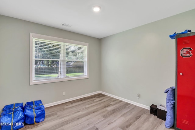 unfurnished room with light hardwood / wood-style floors