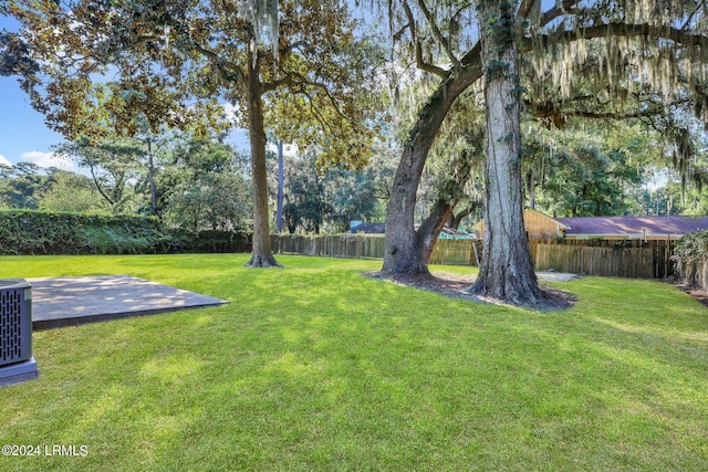 view of yard with central AC