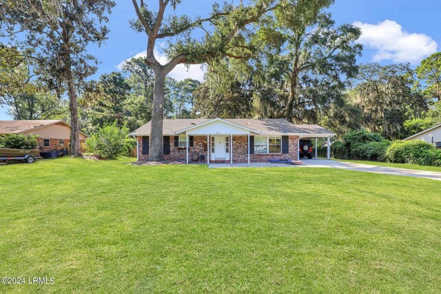 ranch-style house with a front lawn and a carport