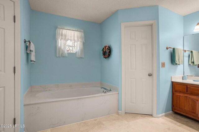 1101 Beavers Den, Beaufort, SC 29902 - full bathroom with vanity, baseboards, a garden tub, and a textured ceiling