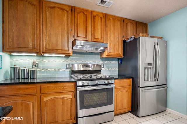 1101 Beavers Den, Beaufort, SC 29902 - kitchen featuring brown cabinetry, appliances with stainless steel finishes, under cabinet range hood, and visible vents