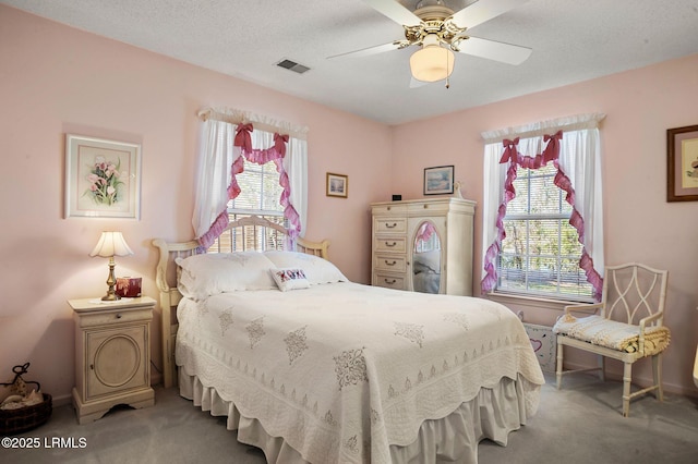 1101 Beavers Den, Beaufort, SC 29902 - carpeted bedroom featuring baseboards, visible vents, ceiling fan, and a textured ceiling