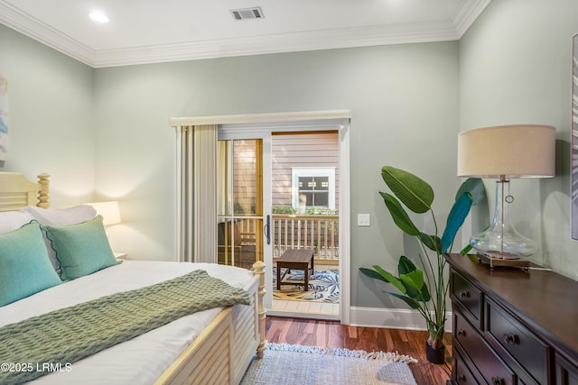 bedroom featuring ornamental molding, access to outside, and dark hardwood / wood-style flooring