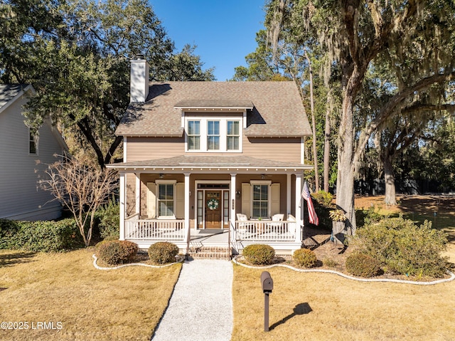 view of front of home with a front lawn and a porch