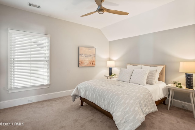 carpeted bedroom featuring vaulted ceiling and ceiling fan