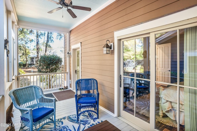 sunroom with a wealth of natural light and ceiling fan