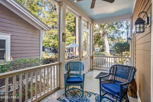 sunroom with vaulted ceiling and ceiling fan