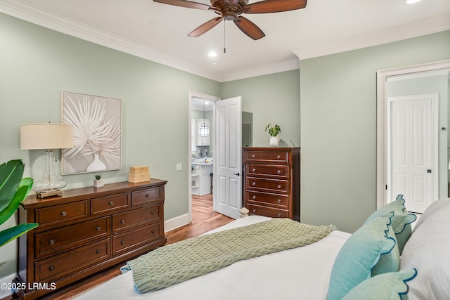 bedroom featuring crown molding, ceiling fan, and light wood-type flooring