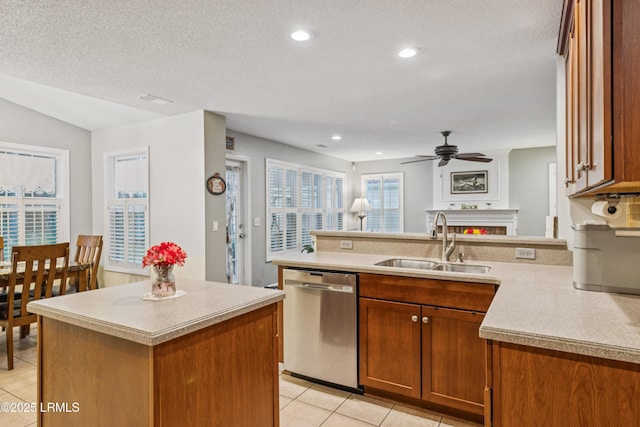 69 Wheatfield Cir, Bluffton, SC 29910 - kitchen with dishwasher, light tile patterned floors, light countertops, ceiling fan, and a textured ceiling