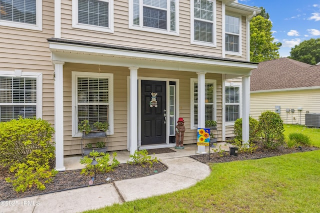 69 Wheatfield Cir, Bluffton, SC 29910 - doorway to property featuring a lawn and covered porch