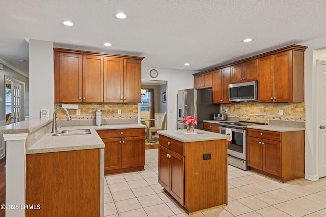69 Wheatfield Cir, Bluffton, SC 29910 - kitchen featuring stainless steel appliances, a peninsula, backsplash, light countertops, and recessed lighting