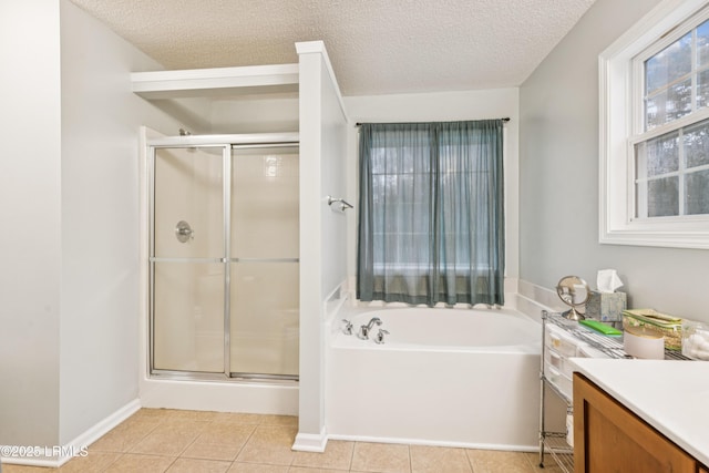 69 Wheatfield Cir, Bluffton, SC 29910 - full bathroom with a garden tub, a stall shower, vanity, a textured ceiling, and tile patterned flooring
