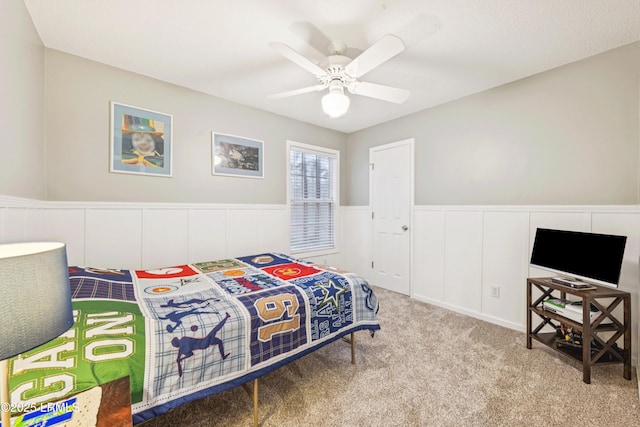 69 Wheatfield Cir, Bluffton, SC 29910 - bedroom featuring carpet floors, wainscoting, ceiling fan, and a decorative wall