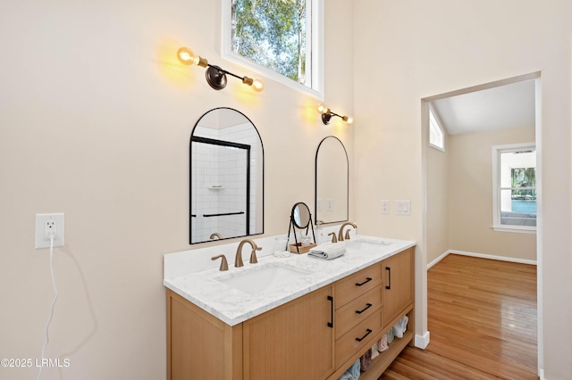 20 Ladys Walk, Beaufort, SC 29907 - bathroom featuring double vanity, wood finished floors, a high ceiling, and a sink
